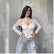 Top A Bustino In Pizzo Bianco Con Maniche Lunghe Trasparenti.